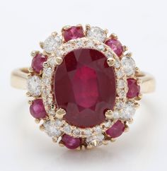 4.90 Carat Natural Red Ruby and Diamond Women Ring Made in 14K Solid Yellow Gold Suggested Retail Price $5,999.00 Total Natural Ruby Weight is - 3.90 Carat Ruby Measurements are - 10.00 x 8.00 mm Total Diamonds Carat Weight is - 1.00 Carat Clarity: SI1 Color: G-H Diamond Cut - Very Good RING SIZE: 6 (FREE SIZING AVAILABLE) RING WEIGHT IS 4.5 gram Disclaimer: All colors, measurements and weights are approximate and may vary slightly from the listed dimensions or as seen in the image'' Luxury Red Cluster Diamond Ring, Red Diamond Cluster Ring With Halo Setting, Classic Red Cluster Diamond Ring, Luxury Red Multi-stone Rings, Luxury Red Cluster Ring, Red Cluster Diamond Ring In 14k Gold, Red Diamond Cluster Ring In 14k Gold, Classic Red Ruby Cluster Ring, Classic Red Cluster Ruby Ring