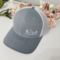 Hiking lovers celebrate the outdoors and an adventurous lifestyle, don't forget your Camping Apparel. Let our mountain hats go with you everywhere on this adventure add it to your hiking gear. This hat guarantees the following -Top quality construction -A great look -Comfortable fit -Snap closure -Trucker Hat ALL HATS SHIP IN A BOX: We package our hats in a box so they reach you in perfect condition. **NO MINIMUM QUANTITY REQUIRED for any Embroidered Hat** **All orders come with custom package t Adjustable Gray Hat For Outdoor Activities, Adjustable Gray Baseball Cap For Outdoor Activities, White Snapback Hat For Outdoor Activities, White Snapback Hat With Flat Brim For Outdoor Activities, Adjustable White Snapback Hat For Outdoor Activities, White Trucker Hat For Outdoor Activities, White Flat Bill Trucker Hat For Outdoor Activities, Snapback Hat With Curved Bill For Outdoor Activities, Adjustable Gray Baseball Cap For Outdoor