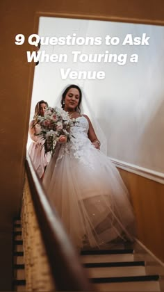 the bride is walking down the stairs with her flower girl