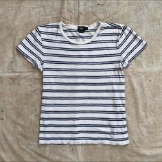 "-Ralph lauren's RRL \"Double rl\" premium vintage inspired label -1950s style striped t-shirt -Single stitch, 100% cotton -16.5\" pit to pit -20.5\" length" Classic Cotton T-shirt With Striped Collar, Classic Short Sleeve Tops With Horizontal Stripes, Classic Striped Top With Three Stripes, Classic Cotton T-shirt With Horizontal Stripes, Classic Striped Cotton T-shirt, Classic Crew Neck Tops With Horizontal Stripes, Classic Striped Crew Neck T-shirt, Classic Fitted Striped T-shirt, Classic Striped Crew Neck Top