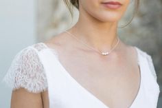 This pretty necklace with back jewel will be perfect to enhance the backless neckline of your wedding dress. The delicacy of its pearls will charm you and bring a very elegant touch to your outfit.It consists of a silver chain, three pearl beads on the front and three dinging on the back.This necklace has no clasp, it simply slips by the head, so you will have to pay attention to the larger hairstyles.Available in silver, gold filled (high quality gold plated) and gold filled rose (high quality Elegant Rose Gold Necklace For Mother Of The Bride, Elegant Rose Gold Pearl Necklace With Delicate Chain, Elegant Pearl White Backdrop Necklace With Pearl Drop, Elegant Silver Backdrop Necklace With Delicate Chain, Delicate White Backdrop Necklace For Wedding, Elegant Pearl Pendant Backdrop Necklace For Party, Elegant Backdrop Necklace With Delicate Chain As Gift, Elegant Adjustable Necklace For Wedding, Elegant Pearl Backdrop Necklace With Pearl Drop