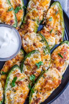 stuffed jalapenos with ranch dressing on a plate