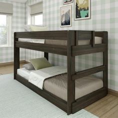 there is a bunk bed in the room with plaid wallpaper on the walls and wood flooring