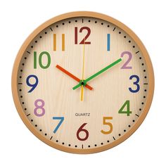 a wooden clock with colorful numbers on the front and back of it's face