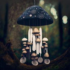 a group of mushrooms hanging from a tree in the forest with an umbrella shaped like a mushroom