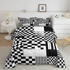 a black and white checkered comforter set on a bed