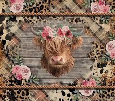 a cow with flowers on it's head is surrounded by pink roses and leopard print