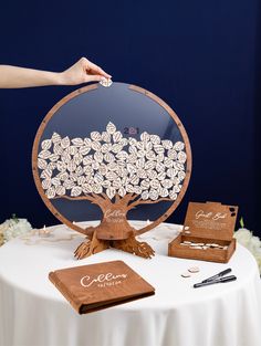 a table topped with a tree cut out of wood