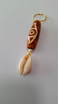 Hair ring made with 1 1/4 inch Tibetan Agate stone with a natural cowrie shell charm.  Rings fit all locs and braids. Braid Jewelry Hair Accessories, Jewelry Hair Accessories, Lock Jewelry, Braid Jewelry, Loc Jewelry, Cowrie Shells, Jewelry Hair, Hair Rings, Charm Rings