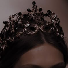 a woman with a tiara on her head