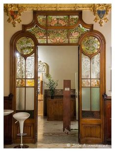 an ornate wooden door leading into a room