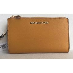 New With Tags 100% Authentic Michael Kors Jet Set Travel Double Zip Wristlet Wallet Marigold With Gold Tone Hardware Saffiano Leather Snap Closure Lined Removable Wristlet Strap 7" Interior Features Zip Pocket, Three Inner Pockets, And 6 Card Holders Id Window Phone Holder, Good For Iphone 8+ Logo Plaque On Front 2 Zip Closure Compartments Length: 7 1/4" Depth: 1 1/2" Height: 4" Classic Gold Bag With Card Slots, Classic Gold Bags With Card Slots, Gold Bifold Bag With Card Slots, Gold Bifold Leather Bag, Gold Clutch Wallet, Gold Evening Bag With Card Slots, Gold Leather Bifold Bag, Gold Clutch Bag With Card Slots, Gold Clutch With Card Slots For Evening