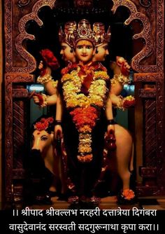 an idol is displayed in the middle of a room with many decorations on it, including flowers