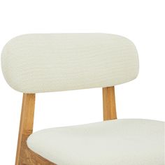 an upholstered wooden chair with white fabric