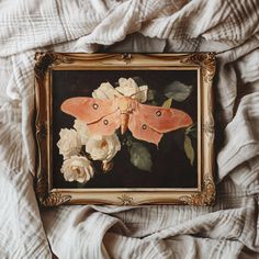 an image of a painting with flowers in the middle and a butterfly on it's back