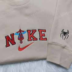 Spider-Man Nike Embroidered Shirt, Custom Nike Embroidered Hoodie, Marvel Embroidered Sweatshirt Our clothing store offers an exceptional collection of embroidered clothing items that are bound to impress anyone who is a fan of Marvel superheroes and Nike. The store’s inventory includes an array of trendy and high-quality embroidered sweatshirts, t-shirts, and hoodies that showcase the perfect blend of style, comfort, and quality. One of our most popular items is the Spider-Man Nike embroi Cute Spider Man Gifts, Spider Man Nike Sweatshirt, Nike Spiderman Sweatshirt, Vintage Nike Hoodie Men, Men’s Fashion Outfits, Spider Man Sweatshirt, Embroidered Hoodie Top For Streetwear, Casual Hoodie With Machine Embroidery For Streetwear, Casual Embroidered Hoodie For Streetwear