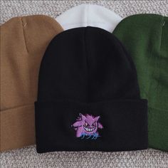 ゲンガー means Gengar in Japanese. A great gift or piece for everyday wear. Direct embroidery, only available here at Embroidered Dad Hats! * Embroidered on a soft acrylic beanie. * Adult, one size fits all. * Embroidered in Dallas, Texas. * Free poly-bag shipping in US (more options at checkout). More styles: Dad Hat https://www.etsy.com/listing/988087326 Bucket Hat https://www.etsy.com/listing/1334494811 If you like this, check out our small shop: https://www.etsy.com/shop/embroidereddadhats If yo Casual Beanie With Embroidered Logo For Winter, Casual Embroidered Logo Beanie For Winter, Casual Beanie With Embroidered Logo, Trendy Beanie With Embroidered Logo, Trendy Winter Hat With Embroidered Logo, Casual Winter Hats With Custom Embroidery, Casual Embroidered Beanie For Winter, Winter Embroidered Beanie, One Size Fits Most, Casual Embroidered Winter Beanie