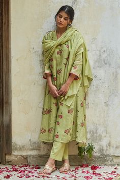 Pista green kurta with all-over Jasmine and Rose block printed motifs and contrast piping. Comes with plain straight fit trouser and handwoven chanderi half width stole.
Component: 3
Pattern: Print and Embellishment
Type Of Work: Block Print
Neckline: V neck
Sleeve Type: Flared Sleeves
Fabric: Handwoven Chanderi and Cotton 
Color: Green
Other Details: 
Rose and Jasmine print
V neck
Pink piping on the neckline and sleeve hems
Occasion: Work - Aza Fashions Green Straight Kurta With Printed Border, Festive Green Salwar Kameez With Printed Border, Green Chanderi Sets With Printed Motifs, Green Anarkali Kurta With Printed Border, Green Block Print Chanderi Sets, Green Chanderi Block Print Sets, Green Block Print Lawn Suit With Straight Kurta, Green Salwar Kameez With Printed Border For Eid, Green Lawn Suit With Block Print Straight Kurta