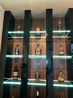 the shelves are filled with different types of liquor