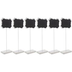 six black and white chalkboard stands with easels on each side, one is empty