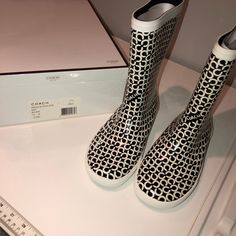 Black And White White Waterproof Rain Boots For Spring, Trendy White Waterproof Boots, White Waterproof Boots For Spring, Waterproof White Boots For Spring, Casual White Waterproof Boots, White Round Toe Rain Boots For Spring, Black Round Toe Rain Boots For Spring, White Sporty Boots For Spring, Coach Rain Boots