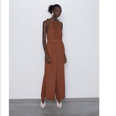 Nwt. Flowy Halter Neck Jumpsuit With Matching Cord Straps. Interior Elastic Waistband. Elegant Brown Jumpsuits And Rompers For Summer, Elegant Brown Summer Jumpsuits And Rompers, Chic Brown Jumpsuits And Rompers For Summer, Chic Brown Jumpsuits And Rompers For Day Out, Chic Brown Jumpsuits And Rompers For Spring, Zara Casual Party Jumpsuits And Rompers, Zara Jumpsuits And Rompers For Summer, Zara Store, Straps Jumpsuit