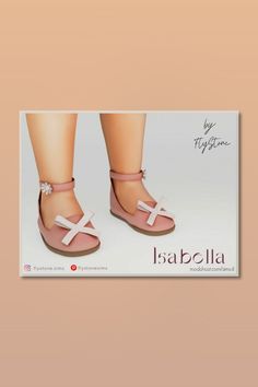 a pair of pink shoes on top of a card