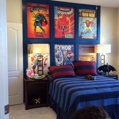 a bedroom with posters on the wall and a bed in it's center area