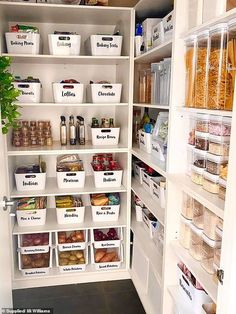 an organized pantry with white bins filled with food