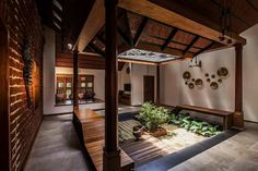 the inside of a house with wood and stone accents on the walls, flooring and ceiling