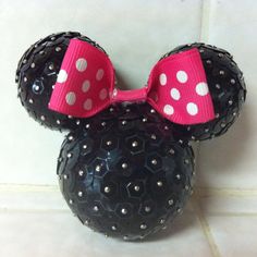 a minnie mouse head with polka dots on it