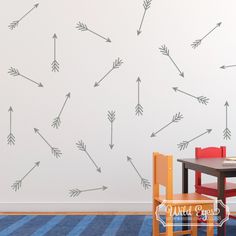 a child's room with a wall painted with arrows