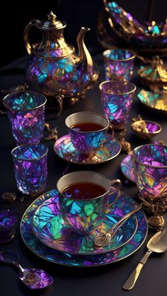 a table topped with tea cups and saucers covered in iridescent glassware