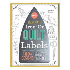 the iron - on quilt labels are shown with scissors and other sewing supplies in front of it