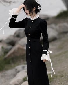 Unleash your vampy side with our Vamp Lady Black Witchy Dark Academia dress. With its elegant pleated white cuffs and collar, accented by luxe gold buttons, this sophisticated dress brings an air of aristocratic grace. Crafted from a very stretchy fabric, this midi-length piece is perfect for any dark witchy mood. ☾ Fulfil your witchy Victorian princess fantasies with our WITCHY ACADEMIA collection featuring dark, gothic and romantic vintage-inspired magic & mystery dresses ☽ Size: S Bust: 82-88 Witchy Dark Academia, Dark Academia Dress, White Dress Aesthetic, Academia Dress, Victorian Princess, Witchy Academia, Dark Princess, Dark Dress, Dark Feminine Aesthetic