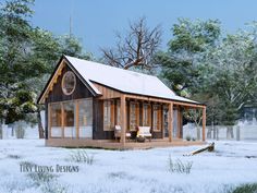 a small wooden cabin sitting on top of a snow covered field next to a tree