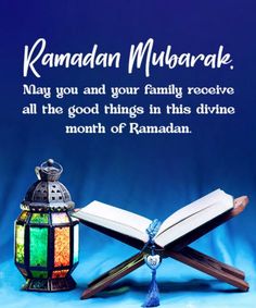 ramadan mubarak with an open book and lamp on blue background for eid