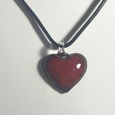 Blood Red Glass Puffed Heart Pendant Necklace , Red Heart Necklace , Glitter Heart , Cord Necklace Heart is 1 1/4 inches including the bale x 1 " wide. Black Cord Necklace is 14 12/ " + 2 " extension / if you want a longer necklace let me know. These can be worn for any reason , casual , Dress , work  Please browse through my store, I add items frequently ! Please ask any questions as I do not accept returns  Thank You ! Red Heart-shaped Adjustable Necklace, Red Adjustable Heart-shaped Necklace, Red Adjustable Heart Necklace, Adjustable Red Heart Necklace, Red Heart Charm Necklace For Gift, Red Heart Necklace For Gifts, Red Adjustable Heart Pendant Necklace, Red Heart Necklace For Gift, Red Adjustable Heart Necklace As A Gift