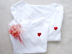 White T-shirt Small Heart T-Shirt White Red Heart Women T-shirt Little Heart T-shirt Red Heart Tshirt Birthday Gift Mother Day Birthday Gift ROUND COLLAR White T-shirt regular cut and breathable material. Soft and comfortable 100% cotton composition and its well-fitted cut. ✅ You can choose the color of glitter heart The heart size is 4,5 cmx 4,5 cm (1,7 inch x 1,7 inch ) for two hearts print  The heart size is 3,8 x 4 cm  (1,5 inch x 1,6 inch ) for one heart print  If you need a larger or small Red Short Sleeve T-shirt For Gift, White T-shirt With Heart Print For Mother's Day, Red Cotton T-shirt With Heart Print, Red Crew Neck T-shirt With Heart Print, Red Cotton Tops As Gift, Red Cotton Tops For Gifts, Red Short Sleeve Tops As Gift, White T-shirt For Valentine's Day Gift, Red Mother's Day Graphic Tee