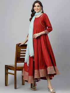 Size & Fit Sizes: To Fit Bust (in inches): S(34), M(36), L(38), XL(40), 2XL(42), 3XL(44) Length: 50 inches PRODUCT DETAILS Consists of a kurta and dupatta Kurta Color: maroon Dupatta color: Blue Solid Round neck Three-quarter, regular sleeves Anarkali shape with angrakha style Ankle length with flared hem Material & Care Viscose Rayon Hand-wash Complete The Look You'll love the elegant design and fit of this stunning dress from Vitans. Dress up for your next family event by pairing this piece wi Angrakha Style, Anarkali Kurti, Family Event, Anarkali Dress, Anarkali, Three Quarter, Salwar Kameez, Ankle Length, Western Outfits