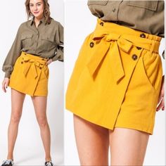 Our Lily Skort Is A Must For The Season!! The Color Is One Of Pantones Top 10, The Style Is So Classy And Have Be Styled Casually Or Dressy! These Paper Bag Waist Skort Feature Button Details And My Favorite Pockets!! True To Size Model Is 5' 9" Tall, 34b Chest, 26" Waist And 35" Hips And Wearing Size Small Fall High-waisted Shorts For Day Out, High-waisted Shorts For Fall Day Out, Chic Skirt-style Cotton Shorts, Chic Yellow Shorts For Workwear, Mini Shorts For Day Out In Fall, Yellow Summer Shorts For Work, Yellow Short Bottoms For Work, Yellow Short Length Bottoms For Workwear, Mini Length Bottoms For Fall Day Out