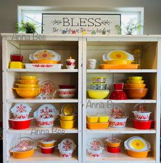 the shelves are filled with colorful dishes and plates