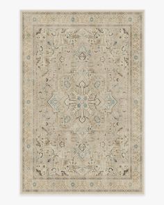 a beige rug with an intricate design on the center and sides, in different colors