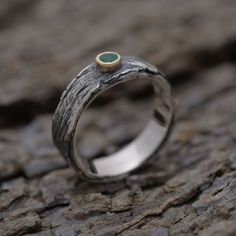 Sterling silver twig ring with natural gemstone nested on gold 14KT top. Unique engagement or anniversary gemstone 5.5mm wide ring for nature lovers. Birthstone ring. Tree branch ring. Renowned for its ability to protect and act as a healing force, the green onyx stone sits atop on a gold 14KT nest. The effect is positively captivating. It makes a lovely signature ring to wear and can also be offered as a unique promise ring for the woman who loves nature and outdoors. As with all of our designs Nature-inspired Sapphire Ring For Anniversary, Nature-inspired Gemstone Rings For Anniversary, Tree Branch Ring, Ring Tree, Signature Ring, Unique Promise Rings, Green Onyx Stone, Signature Rings, Promise Ring For Her