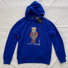 Polo Ralph Lauren Men’s Polo Bear Hoodie New With Tags Size: Small Color: Royal Blue Blue Hoodie With Embroidered Logo For Winter, Winter Blue Hoodie With Embroidered Logo, Winter Blue Sweatshirt With Embroidered Logo, Blue Crew Neck Hoodie With Embroidered Logo, Blue Winter Sweatshirt With Embroidered Logo, Blue Hoodie With Embroidered Logo, Ralph Lauren Polo Bear Sweater Outfit, Blue Fleece Tops With Embroidered Logo, Blue Cotton Hoodie With Embroidered Logo