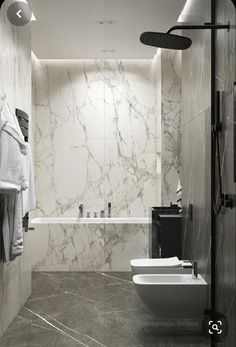 a bathroom with marble walls and flooring