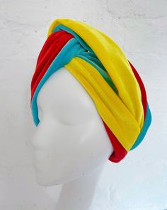 Pica Pica Feathers brings you our range of velvet twistband style turbans.  This one is made out of our luxury soft yellow, red and sky blue stretch velvet.  It such a versatile accessory and easy to style. Just pop it on your head! And the velvet is so soft to touch.  It is a wide fitting headband and perfect to keep your ears warm during the cooler months and keep your hair off your face stylishly with this luxury bohemian vintage style accessory. We have two different sizes - S/M (51-55cm) M/L (56-60cm) In most cases the M/L will work better for that VA VA VOOM turban!  ALL ITEMS ARE MADE TO ORDER and can take up to two weeks to be made and shipped.  Check out our other colours too!  Please read terms and conditions below:  Much love  Vicky  Pica Pica Feathers  T's & C's *all times are Luxury Bohemian, Knot Turban Headband, Velvet Turban, Vintage Bohemian Style, Turban Headband, Velvet Headband, Twisted Band, Va Va Voom, Soft Yellow