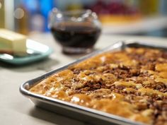 a pan filled with food sitting on top of a table