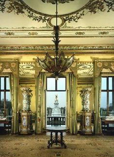 an ornately decorated room with large windows