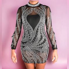 Be The Life Of The Party In This Sexy Dress! Featuring; Rhinestone And Pearls With Feathers On The Arms, Detail, Sheer Throughout The Whole Dress With Polyester Followed By A Fitted Wear. Stretch Fit. Rhinestone Mini Bodycon Dress For Party, Rhinestone Mini Bodycon Party Dress, Party Mini Bodycon Dress With Rhinestones, Mini Bodycon Dress With Rhinestones For Party, Glamorous Mini Dress With Rhinestones For Party, Embellished Mini Dress For Club And Party Season, Mini Sequin Dress With Rhinestones For Party, Mini Sequin Party Dress With Rhinestones, Glamorous Rhinestone Bodycon Dress For Party